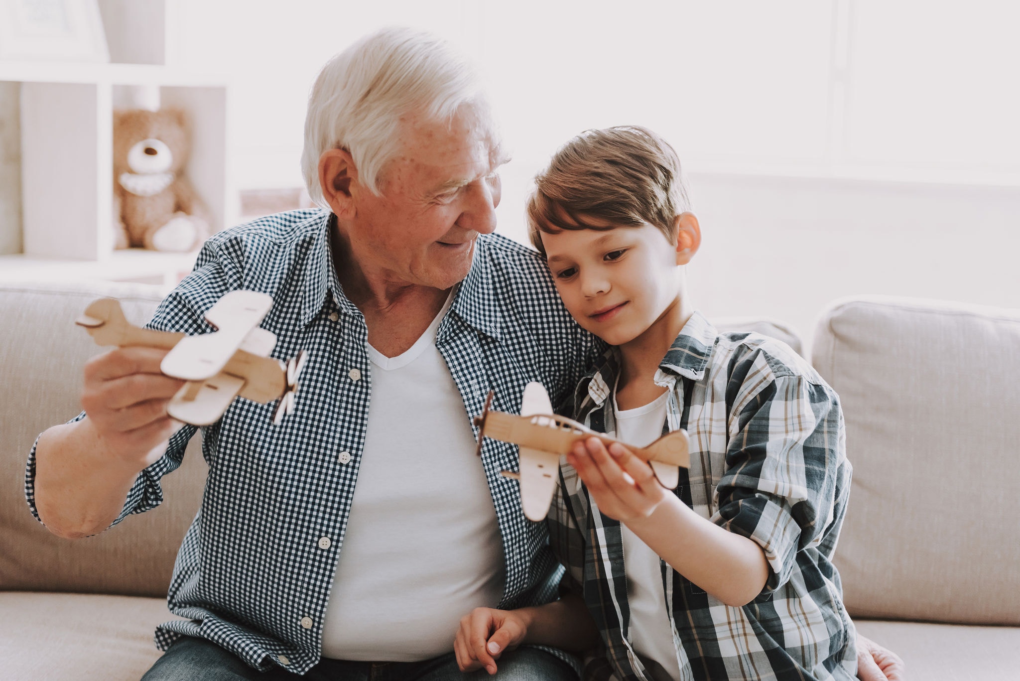 Grandpa and Grandson Playing with Toys. 