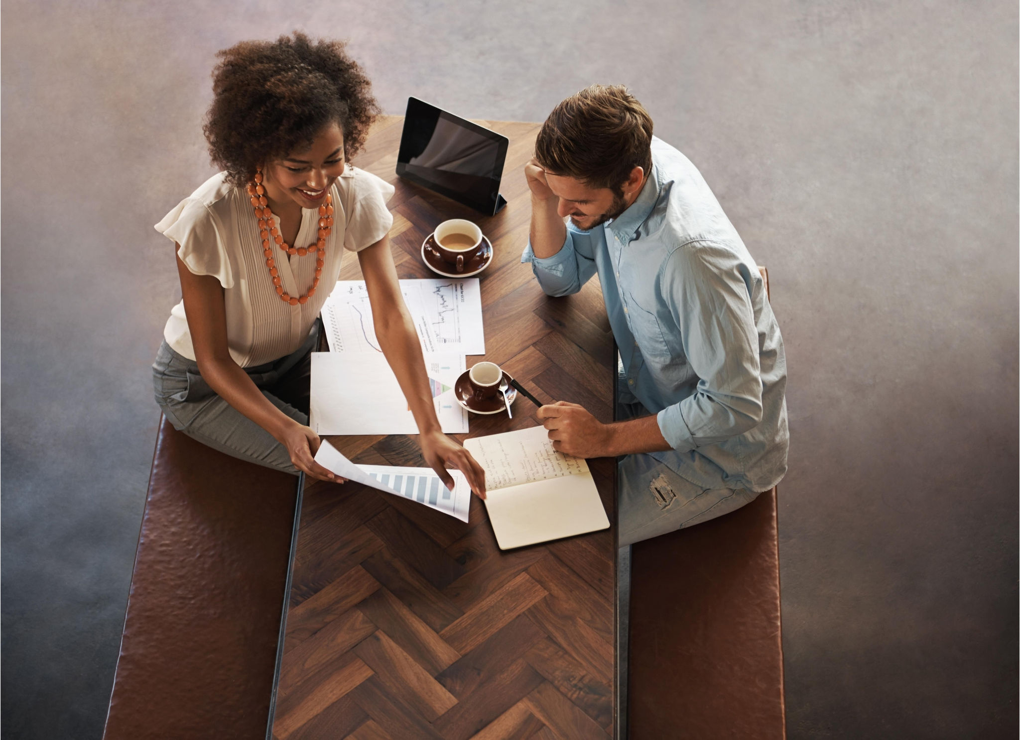 Colleagues working over a coffee