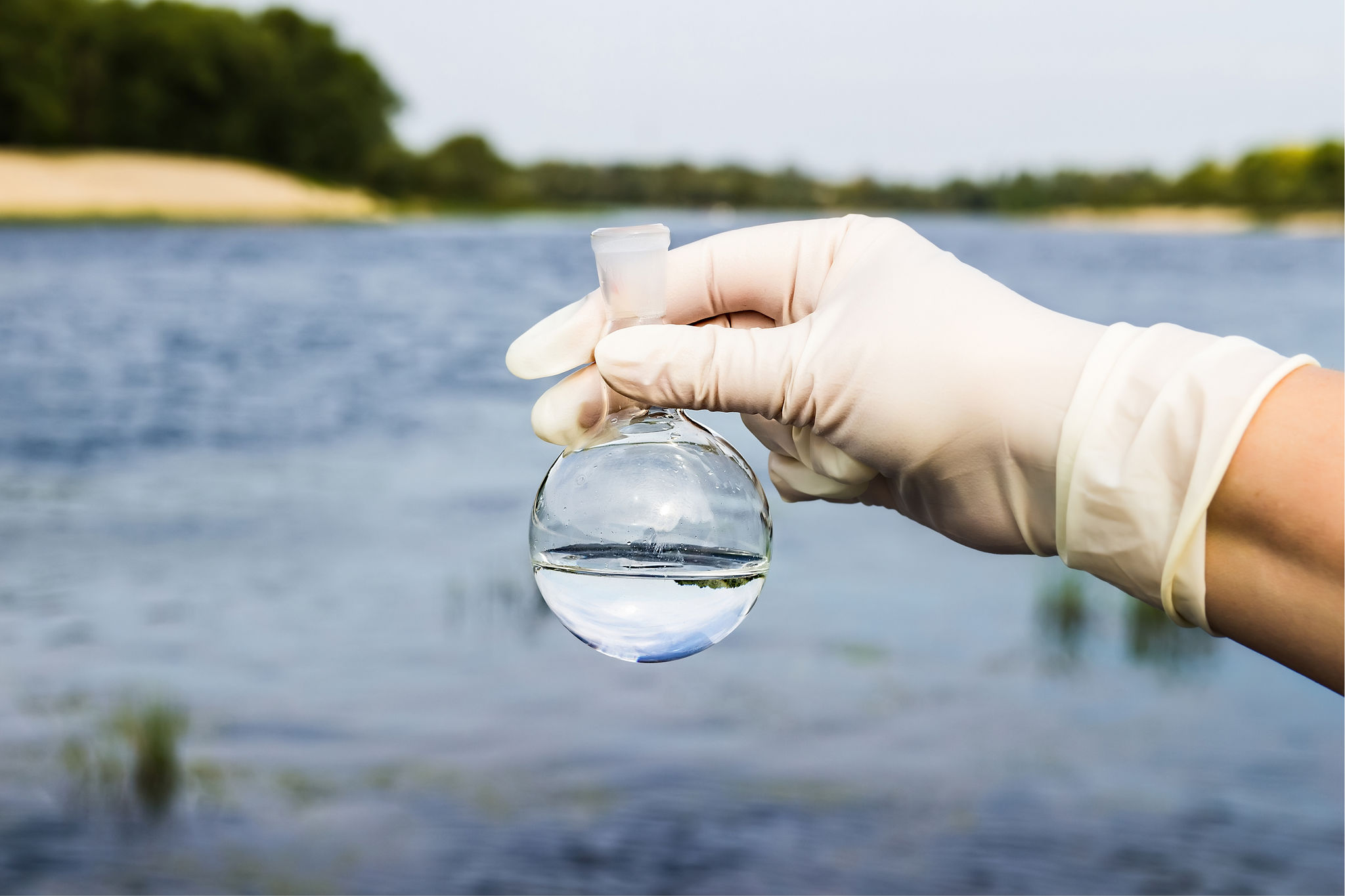 A test tube held over the lake