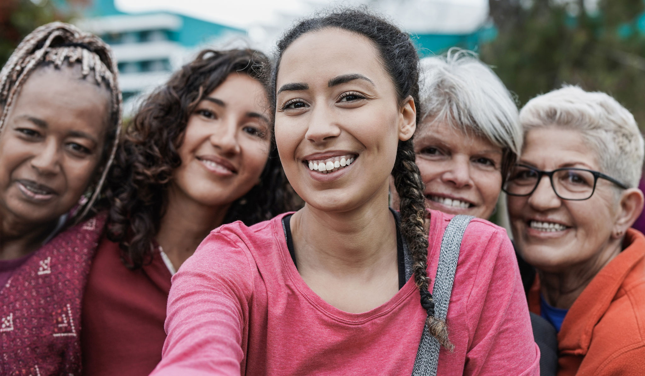 Group of women standing together smiling