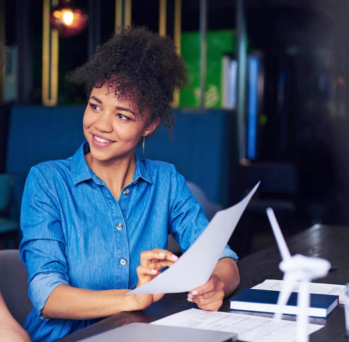 Male and female colleagues chatting at work