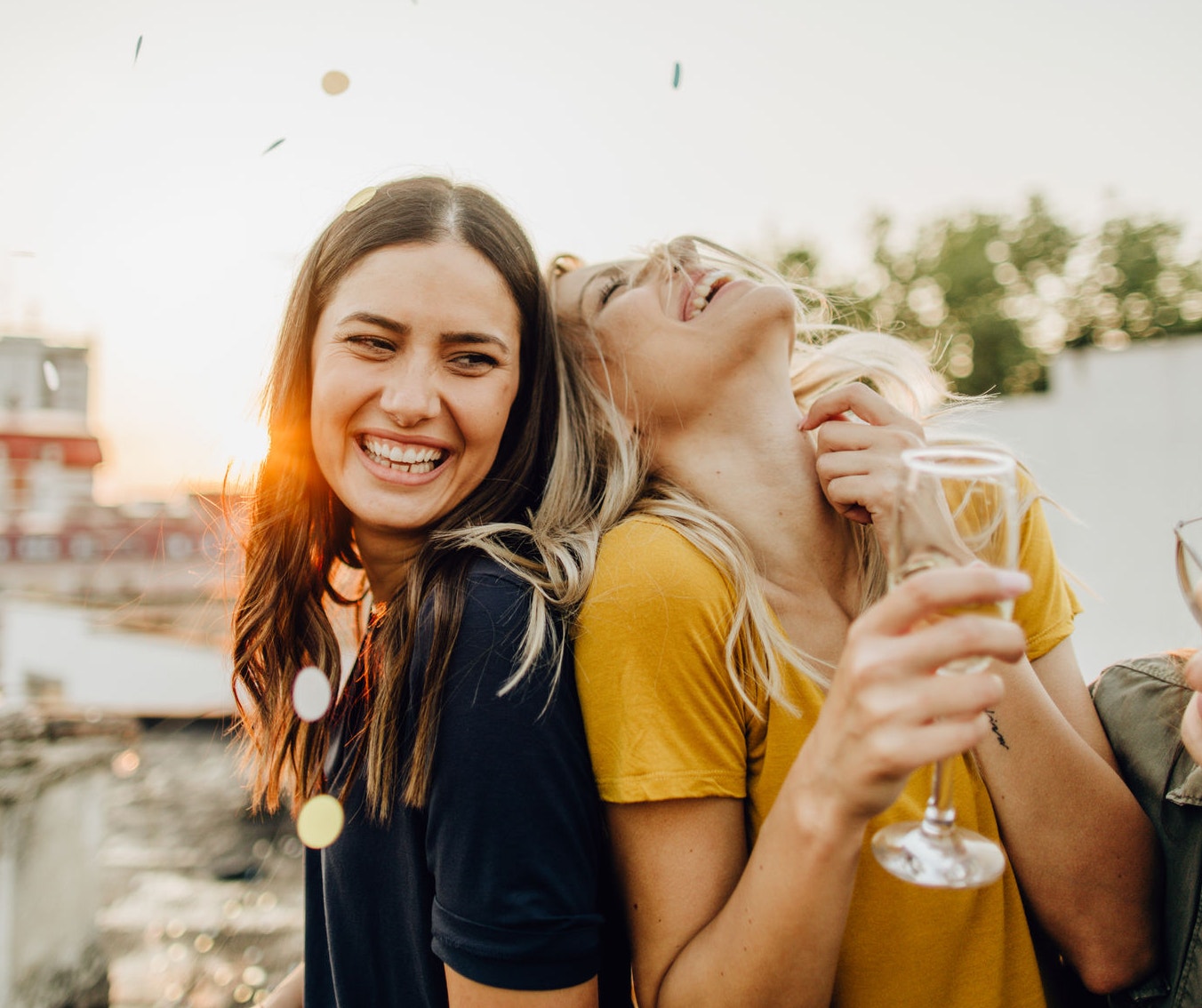 Group of girls on the rooftop celebrating 