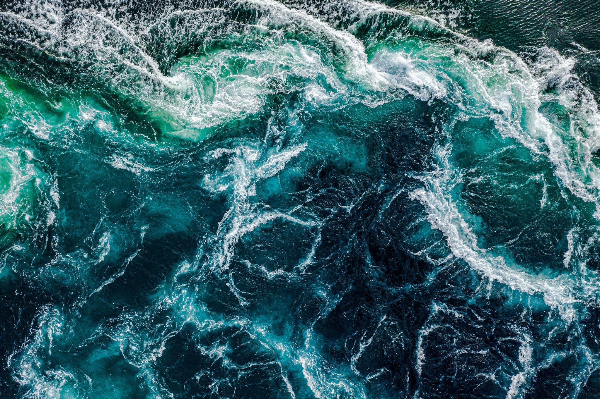 Waves of water of the river and the sea meet each other during high tide and low tide