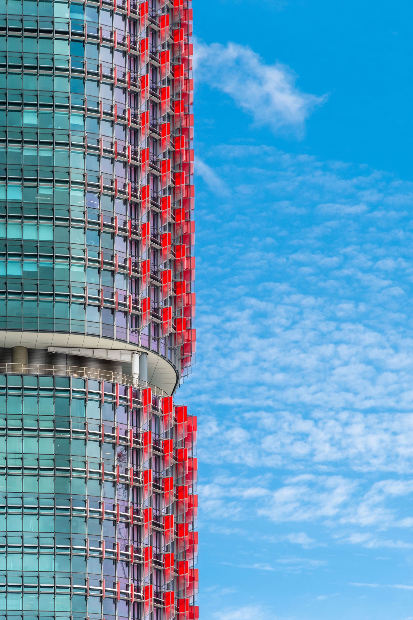 Modern office skyscraper against a blue sky