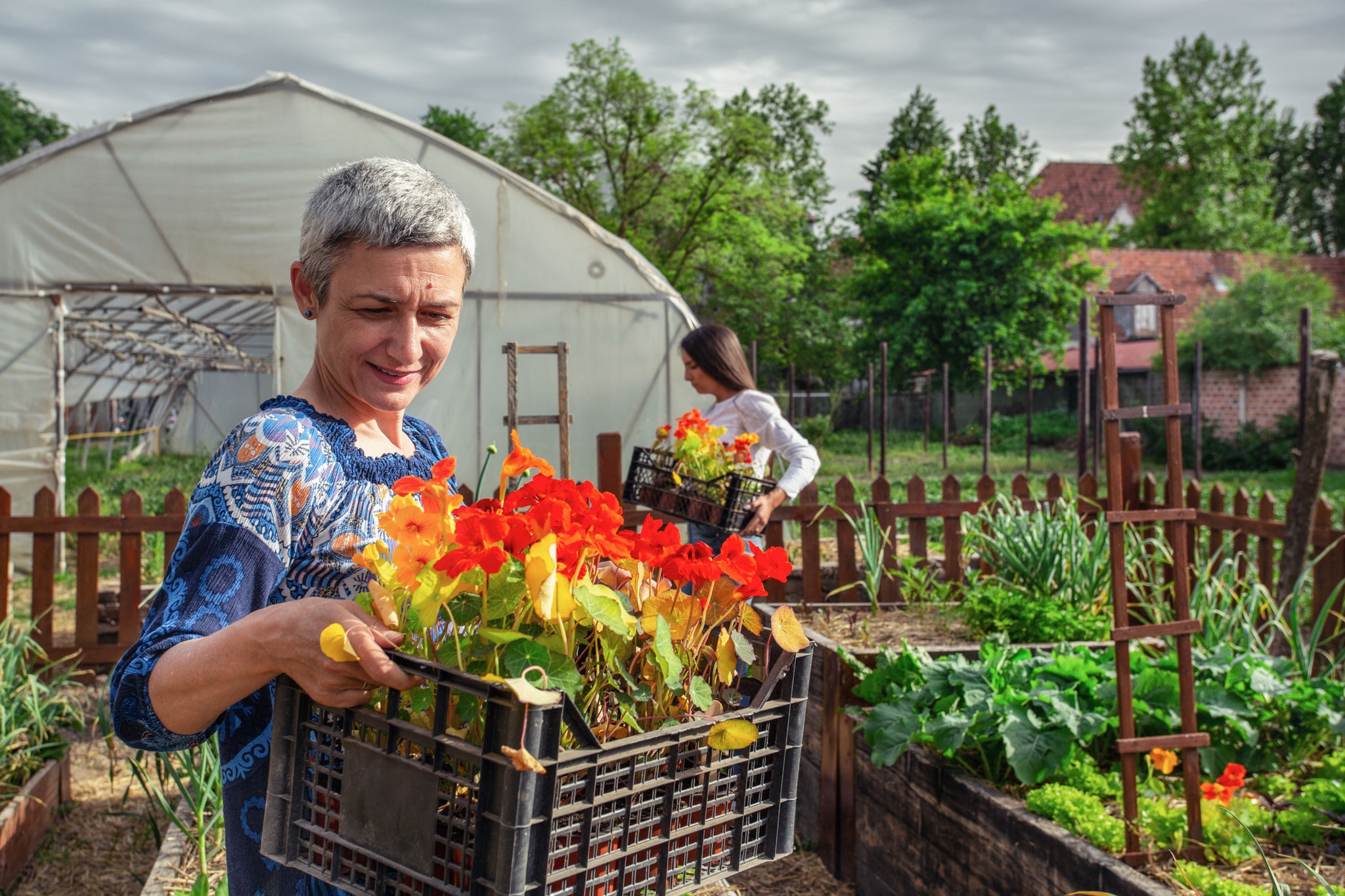 Mother And Daughter Working in the garden center.