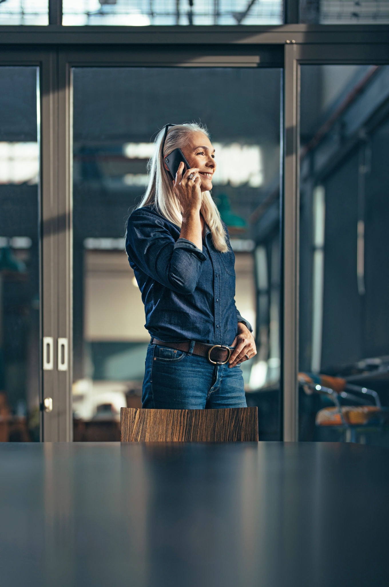 Woman on the phone in a meeting room