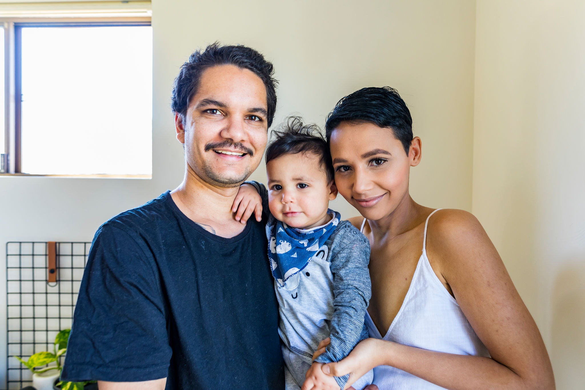 A young family with their baby at home